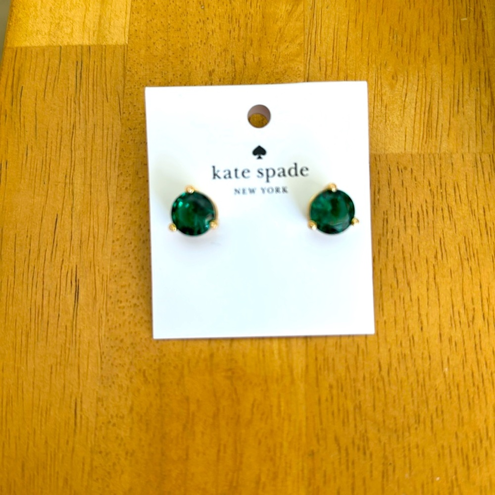 Kate Spade Emerald colored earrings with 3 mini crystals around each stone. NEW.
